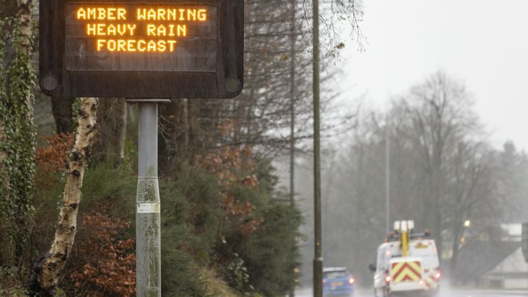 An amber weather warning sign on the motorway in Dumfries.  An amber weather warning for heavy rain has been issued for parts of Scotland as the Met Office says the deadly tornado that sent temperatures plummeting in the US is now causing wet and windy weather in the UK. .  Photo date: Friday, December 30, 2022.