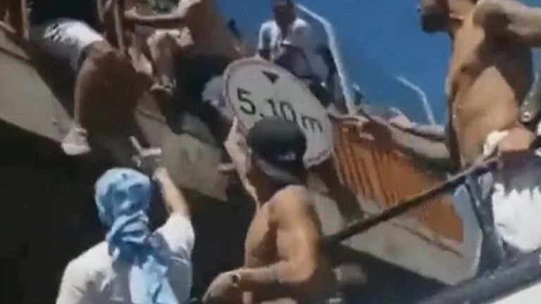 Fans jump into the Argentina squad bus during their victory parade.