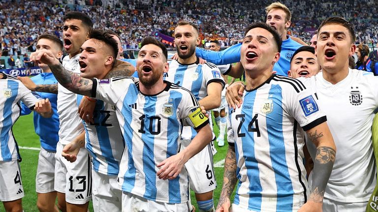 Argentina&#39;s Lionel Messi, Enzo Fernandez and teammates celebrate qualifying for the World Cup semi finals after beating the Netherlands in a penalty shoot-out 