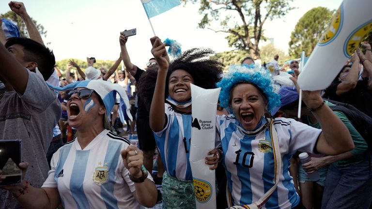 Argentinian soccer fans celebrate a goal while watching their team's World Cup semi-final match against Croatia, hosted by Qatar, on a screen set up in the Palermo neighborhood of Buenos Aires, Argentina, on Tuesday, December 13, 2022. (AP Photo/Rodrigo Abd)