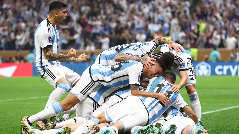 Messi celebrates scoring their first goal with teammates 