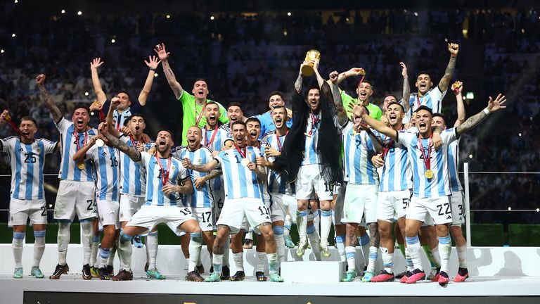 Soccer Football - FIFA World Cup Qatar 2022 - Final - Argentina v France - Lusail Stadium, Lusail, Qatar - December 18, 2022 Argentina&#39;s Lionel Messi celebrates winning the World Cup with the trophy REUTERS/Carl Recine
