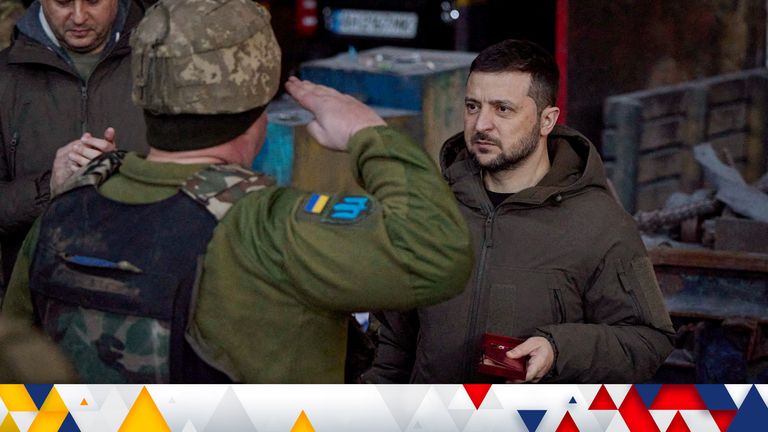 Ukraine&#39;s President Volodymyr Zelenskky awards a Ukrainian service member at a position in the frontline town of Bakhmut