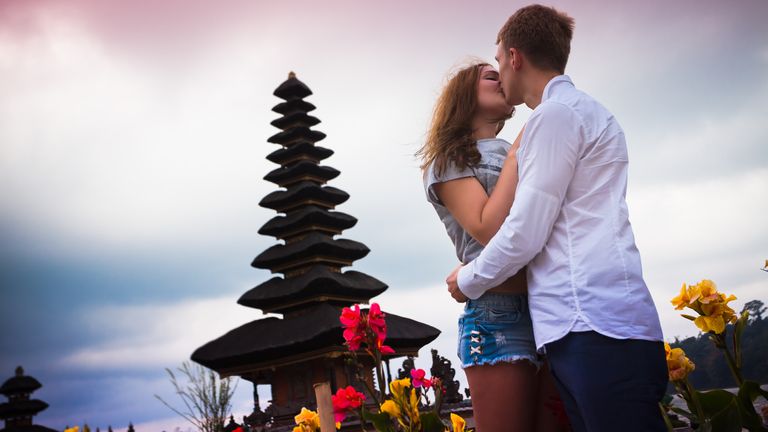 A couple at a temple in Bali, Indonesia