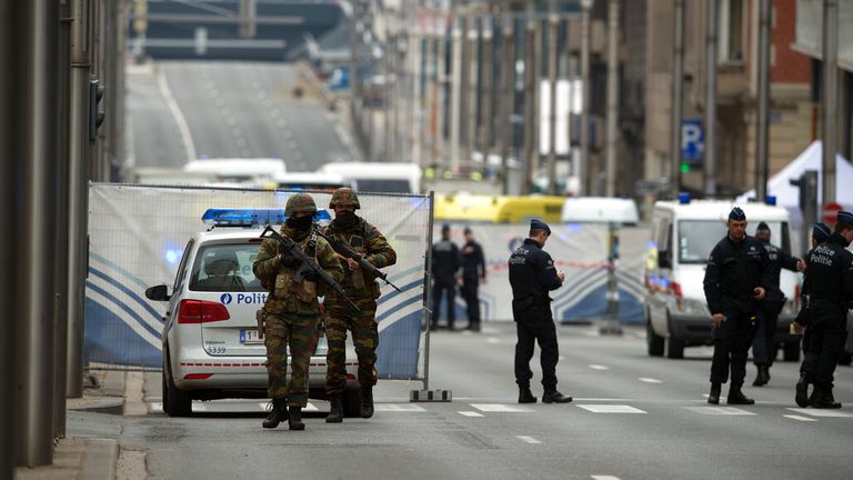 Security forces patrol the area surrounding the Maelbeek metro station in Brussels in March 2016 following a terror attack