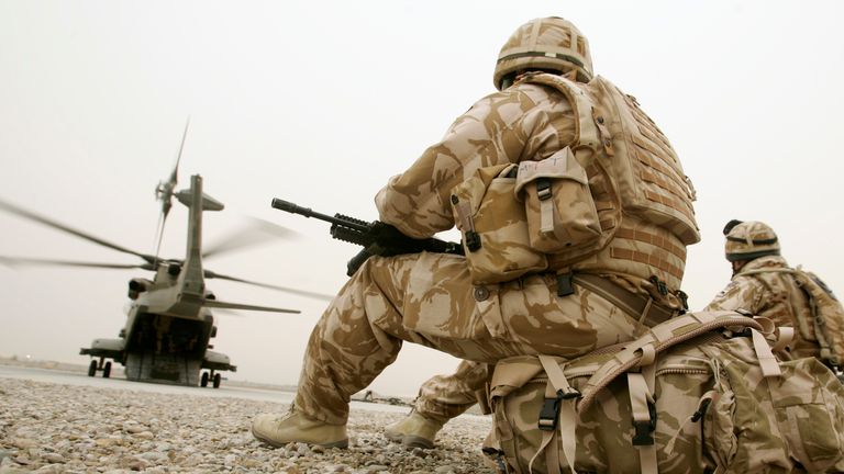 British soldiers wait to be transported to a base in the provincial capital Lashkar Gar in Camp Bastion, Helmand, February 5, 2010. REUTERS/Baris Atayman (AFGHANISTAN - Tags: MILITARY POLITICS CONFLICT)
