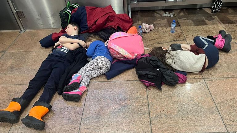 James Brookbank&#39;s three children sleeping on the floor of Brussels airport. Pic: James Brookbank