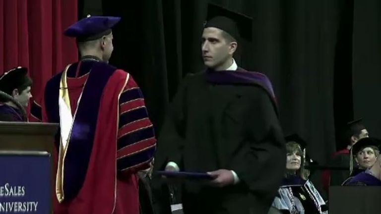 Kohberger receiving his diploma from DeSales graduation in May