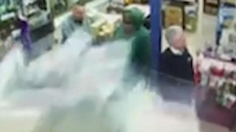 Customers are about to be hit with debris as a car is accidentally driven into a deli