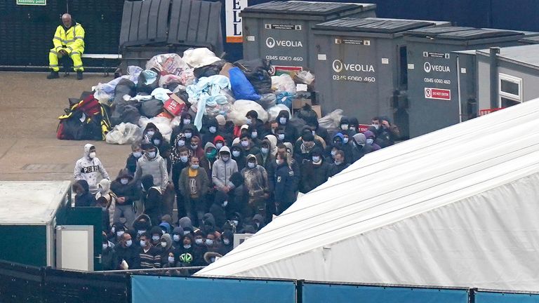 A group of people thought to be migrants wait to be processed after being brought in to Dover, Kent, onboard a Border Force vessel, following a small boat incident in the Channel. Picture date: Monday November 14, 2022.