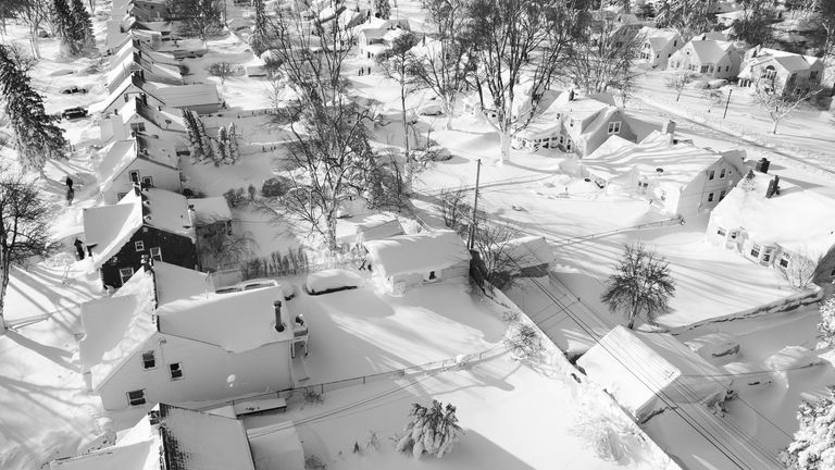 In this drone image, snow blankets a neighbourhood, Sunday, Dec. 25, 2022, in Cheektowaga, N.Y