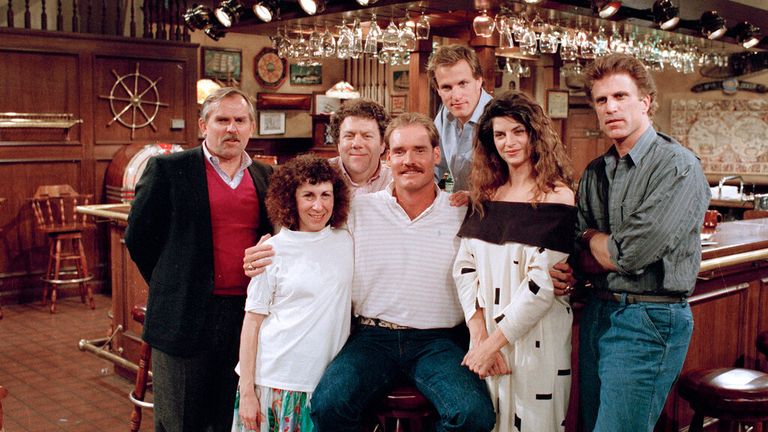 Boston Red Sox third baseman Wade Boggs, center, poses, March 2, 1988, with the cast of "Cheers" during rehearsal for an episode in which he appears. Cast members include, John Ratzenberger, Rhea Perlman, George Wendt, Woody Harrelson, Kirstie Alley and Ted Danson