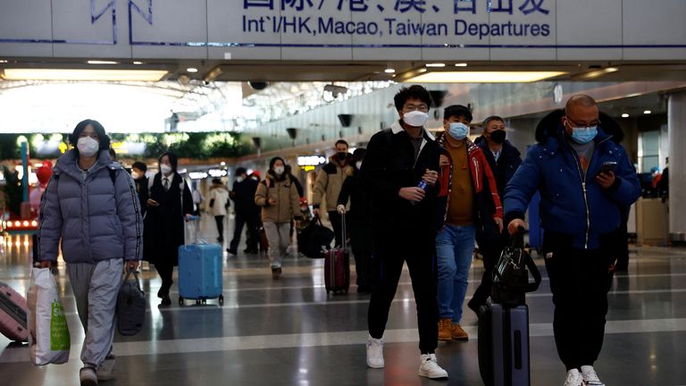 Travellers at Beijing Capital International Airport