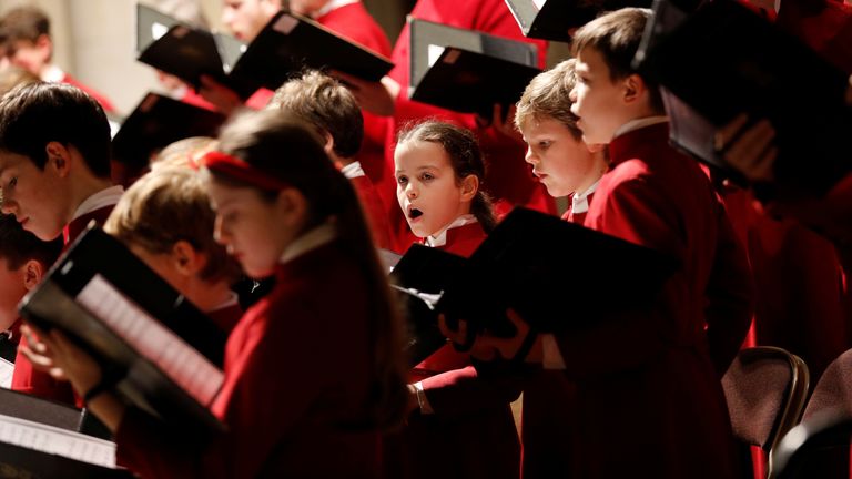 Pupils sing during a Christmas Carol service. Pic: Reuters 