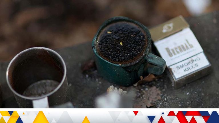 A frozen cup of coffee can be seen in a field position as Russia’s invasion on Ukraine continues near Bakhmut in Ukraine, December 3, 2022. REUTERS/ Leah Millis TPX IMAGES OF THE DAY