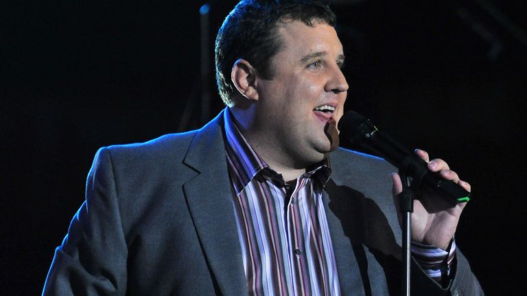 British comedian Peter Kay introduces singer Robbie Williams in 'The Help of Heroes' at Twickenham Stadium in London on Sunday 12th September 2010.  (AP Photo/Mark Allen)