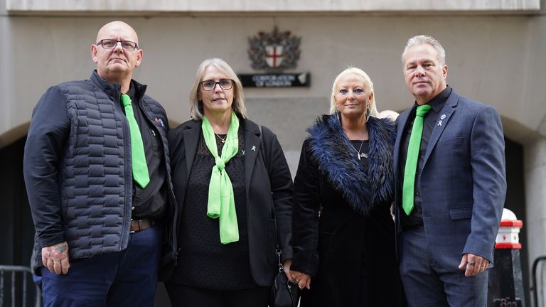 Harry Dunn's family (left to right) father Tim Dunn, stepmother Tracey Dunn, mother Charlotte Charles and stepfather Bruce Charles pose for a photo outside the Old Bailey in London in October 2022