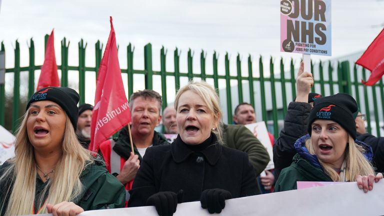 Solidarity Secretary General Sharon Graham (centre), joins ambulance workers on the fence outside the ambulance headquarters in Coventry