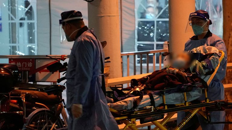 Medical staff moves a patient into a fever clinic at a hospital, as coronavirus disease (COVID-19) outbreaks continue in Shanghai, China, December 19, 2022. REUTERS/Aly Song