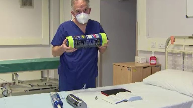 Dr David Nicholl, clinical lead for neurology at Sandwell and West Birmingham NHS Trust demonstrating laughing gas cannisters