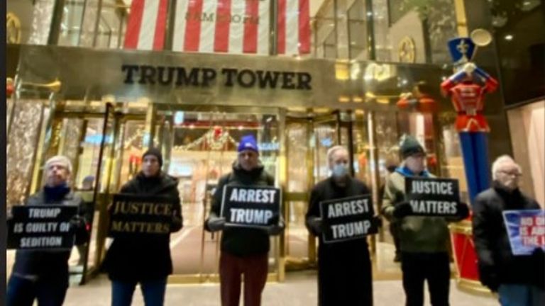 The picture shows protesters outside Trump Tower in New York 