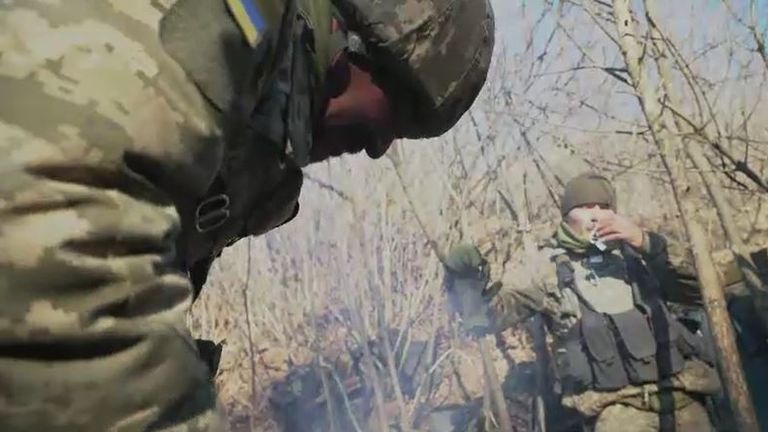 Soldiers try to warm up as temperatures drop