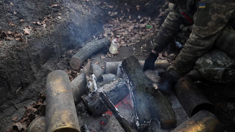 Ukrainian service members fight and stay warm in the Donetsk region Sergiy, 35, an operator of a self-propelled artillery vehicle with the Ukrainian army's 24th King Danylo Mechanized Brigade heats water for the cafe while waiting for coordinates to hit a Russian military target as Russia's invasion of Ukraine continues near Bakhmut in Ukraine, December 3, 2022. REUTERS/ Leah Millis