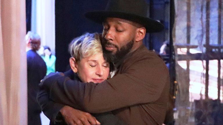 FILE - In this photo released by Warner Bros., talk show host Ellen DeGeneres embraces Stephen "tWitch" Boss during a taping of "The Ellen DeGeneres Show" at the Warner Bros. lot in Burbank, Calif. Boss, a longtime DJ and co-executive producer on the talk show ...The Ellen DeGeneres Show... and former contestant on the dance competition show, ...So You Can Think You Can Dance...  has died at the age of 40. (Photo by Michael Rozman/Warner Bros., File)
