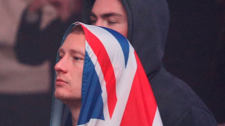 A fan is pictured in Manchester as England are knocked out of the tournament 