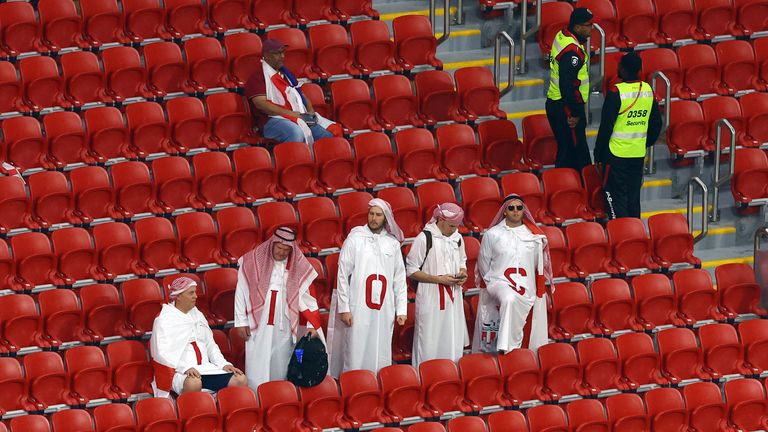 Three Lions fans hang their heads in the stands after the quarter-final defeat 