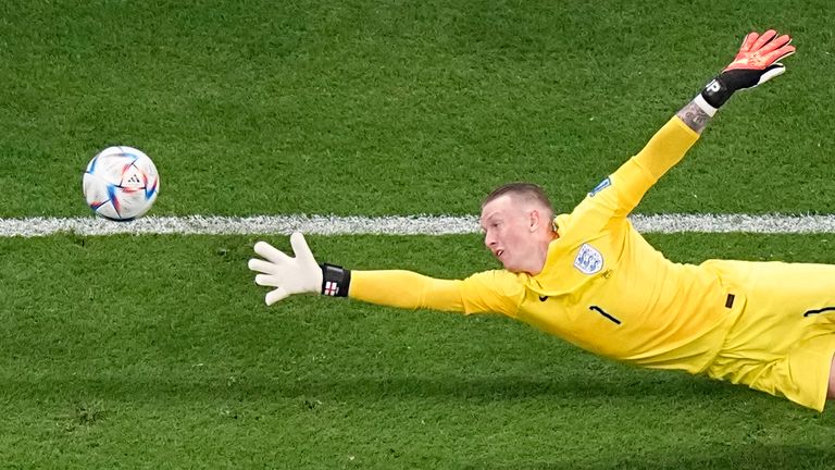 England&#39;s goalkeeper Jordan Pickford fails to stop a shot on goal by France&#39;s Aurelien Tchouameni who scored his side&#39;s first goal during the World Cup quarterfinal soccer match between England and France, at the Al Bayt Stadium in Al Khor, Qatar, Saturday, Dec. 10, 2022. (AP Photo/Pavel Golovkin)