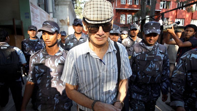 FILE PHOTO: French serial killer Charles Sobhraj leaves Kathmandu district court after his hearing in Kathmandu May 31, 2011 