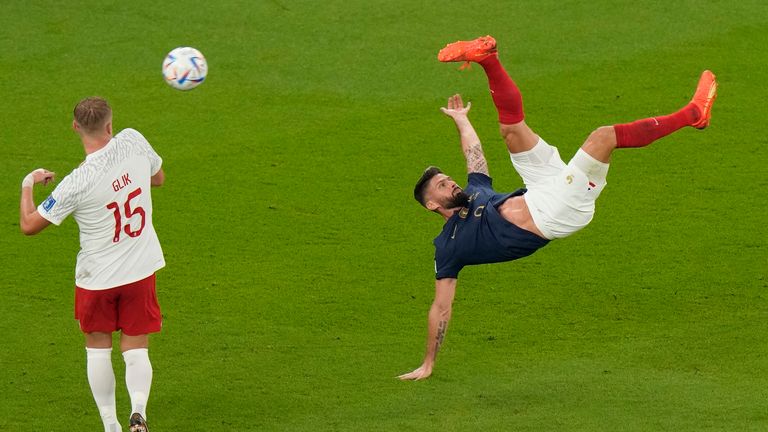 France&#39;s Olivier Giroud goes for an overhead kick during the World Cup round of 16 soccer match between France and Poland, at the Al Thumama Stadium in Doha, Qatar, Sunday, Dec. 4, 2022. (AP Photo/Luca Bruno)