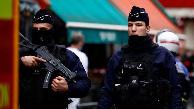 French police and firefighters secure a street after shots were fired killing two people and injuring several in a central district of Paris, France, December 23, 2022. REUTERS/Sarah Meyssonnier