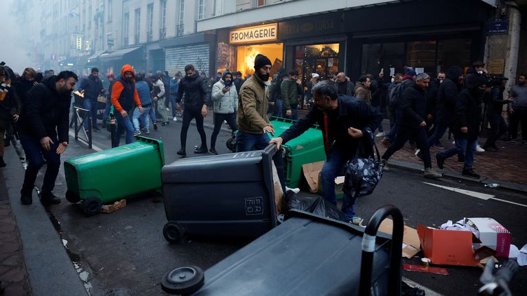 Protestors clash with French police during a demonstration near the Rue d&#39;Enghien after gunshots were fired killing and injuring several people in a central district of Paris, France, December 23, 2022. REUTERS/Sarah Meyssonnier
