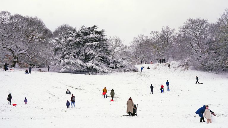 Families sledging through the snow in Greenwich Park, south-east London. Snow and ice have swept across parts of the UK, with cold wintry conditions set to continue for days. Picture date: Monday December 12, 2022.
