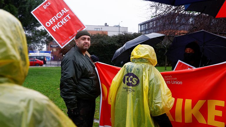 Members of the Public and Commercial Services (PCS) Union take part in a border force workers strike action near Heathrow Airport