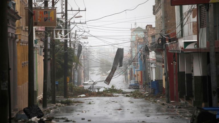 Debris hangs in the street following the passage of Hurricane Ian in Pinar del Rio, Cuba, September 27, 2022. REUTERS/Alexandre Meneghini