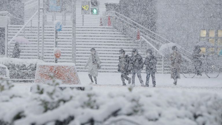 The white snow covers the ground in Nagoya City, Aichi Prefecture on December 24, 2022.( The Yomiuri Shimbun via AP Images )