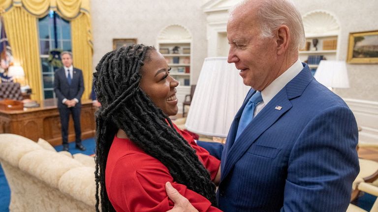 Joe Biden is seen in this White House promotional photo taken in the Oval Office following the release of his wife, WNBA basketball star Brittney Griner Biden) hugged her 