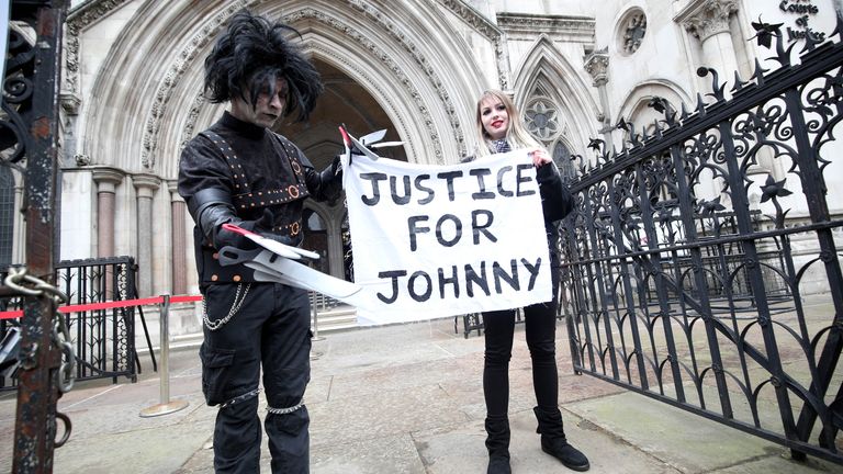 Supporters of Johnny Depp, one dressed as Edward Scissorhands played by Depp in the Tim Burton 1990 film of the same name, wait outside the Royal Courts of Justice in London, ahead of a ruling on Depp&#39;s application to the Court of Appeal.