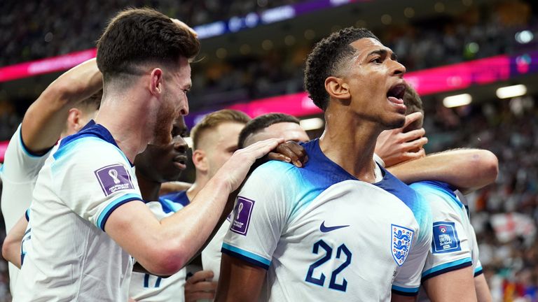 England&#39;s Jude Bellingham celebrates the opening goal scored by Jordan Henderson during the FIFA World Cup 