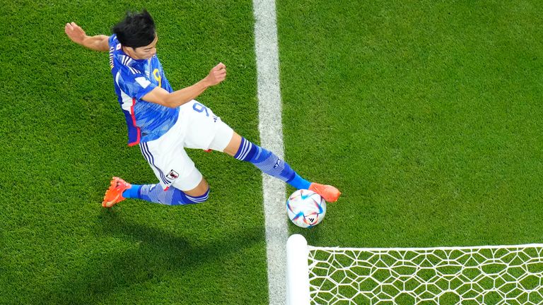 Japan&#39;s Kaoru Mitoma appears to play the ball over the line before crossing it for a goal during the World Cup group E soccer match between Japan and Spain
PIC:AP 