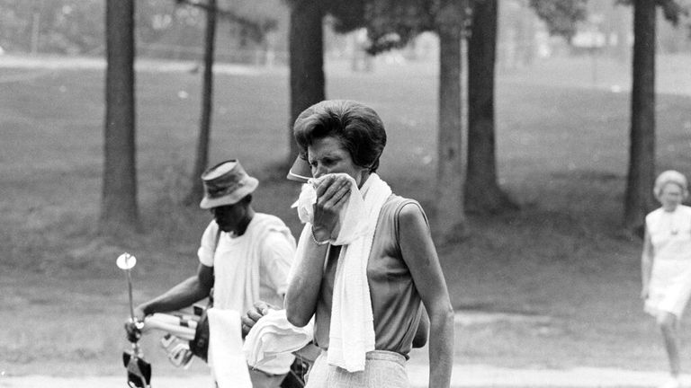 Kathy Whitworth wipes sweat from her face while waiting to tee off at the Raleigh LPGA golf tournament in Raleigh, N.C., July 22, 1972. Pic: AP
