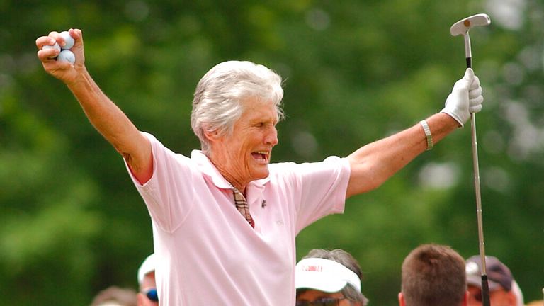 Kathy Whitworth responds to the crowd as she prepares to tee off during the Tournament of Champions golf tournament at Locust Hill Country Club in Pittsford, N.Y. on June 20, 2006. Former LPGA Tour player Whitworth, whose 88 victories are the most by any golfer on a single professional tour, died on Saturday, Dec. 24, 2022, night, her longtime partner said. She was 83. (Carlos Ortiz/Democrat & Chronicle via AP, File)