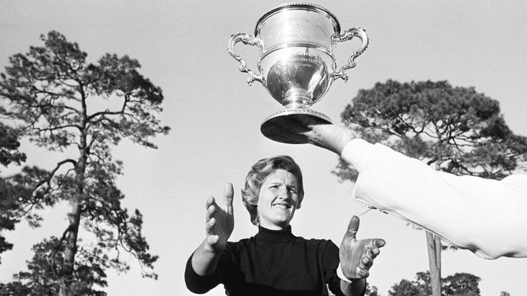 Kathy Whitworth of San Antonio, Texas reaches for the winners' cup as she leads the field of 36 heading into the final round on Sunday, Nov. 27, 1965 with a 54-hole total of 216 in women's titleholders golf Tournament in Augusta, Ga. (AP Photo/Horace Cort) Pic: AP