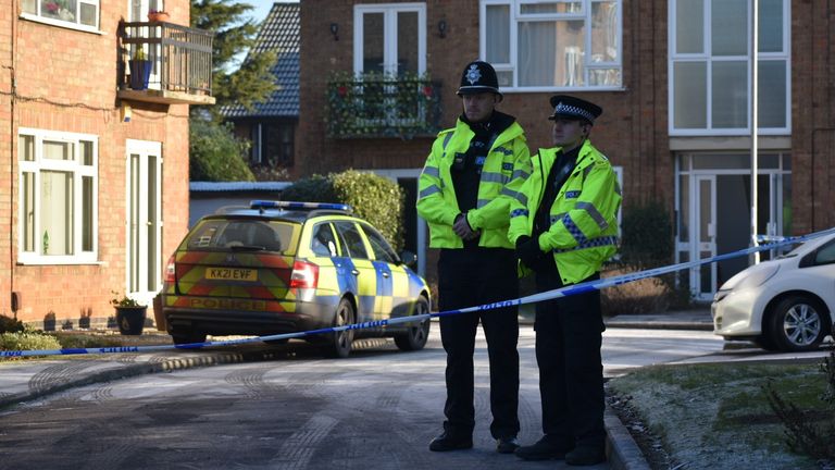 Police officers at the scene in Kettering, Northamptonshire. Northamptonshire Police have named a woman and two children who died in a suspected murder in Kettering as 35-year-old Anju Asok, six-year-old Jeeva Saju and Janvi Saju, four.