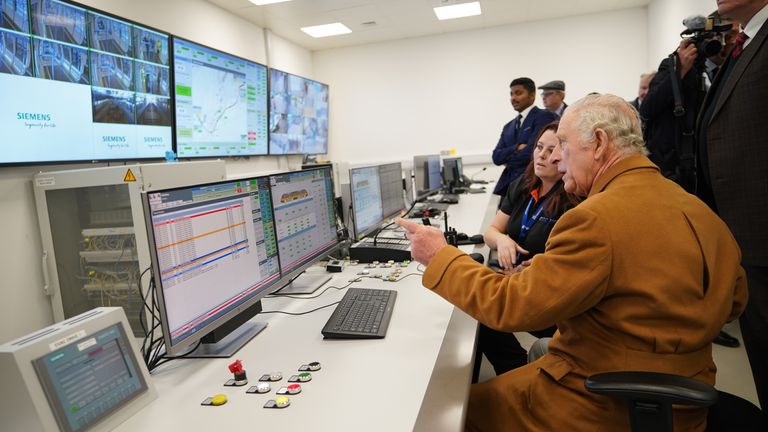 King Charles III is shown the control room during a visit to Luton DART Parkway Station to learn about the new cable-drawn mass passenger transit system which will connect Luton Airport Parkway rail station to London Luton Airport. Picture date: Tuesday December 6, 2022.
