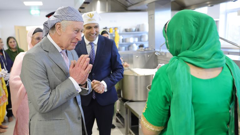 King Charles III makes the traditional namaste gesture as he speaks to volunteers and learns about the programmes they deliver for the local community during a visit to the newly built Guru Nanak Gurdwara in Luton, to meet volunteers and learn about the programmes they deliver for the local community. Picture date: Tuesday December 6, 2022.
