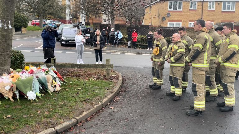 Members of West Midlands Fire Service pay tribute to three boys who died after falling through ice into a lake at Kingshurst